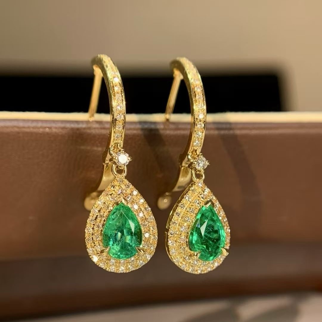 14k Gold 1.33 Ct Natural Emerald & Diamond Earrings: Ref:231175085gold // content:14k // goldmain // gemstone:emeraldnumber // of // stones:2shape:pearcarat // weight:1. 33ct // color:greentreatment:naturaladjacent // gemstone // 2 // : //