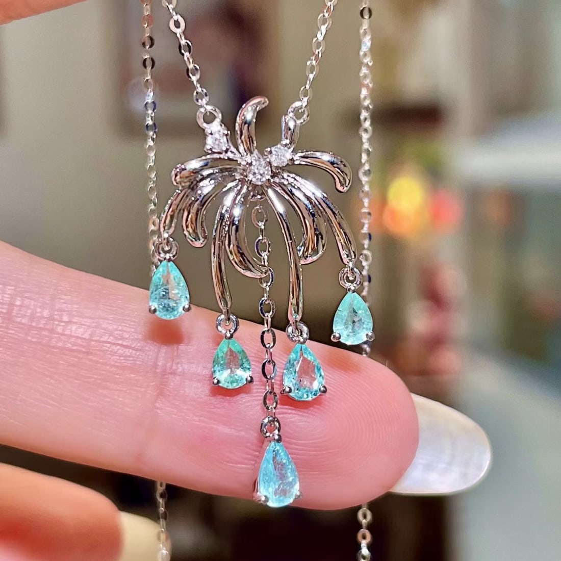 14k Gold 0.78 Ctw Natural Paraiba Tourmaline & Diamond Necklace: Ref:231175115gold // content:14k // goldmain // gemstone:paraiba // tourmalineshape:pearcarat // weight:0. 73ct // color:bluetreatment:naturaladjacent // gemstone // 2 // : // diamondshape:roundcarat 
