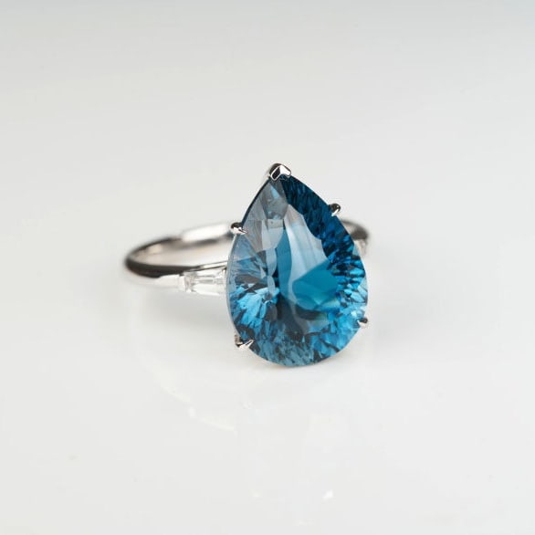 14k Gold 8.72 Ct Natural Topaz & Sapphire Ring: Ref:231175253gold // content:14k // goldring // size:7. 25usmain // gemstone:topazshape:pearcarat // weight:8. 72ct // color:bluetreatment:naturaladjacent // gemstone // 2 // : // sapphirenumber //