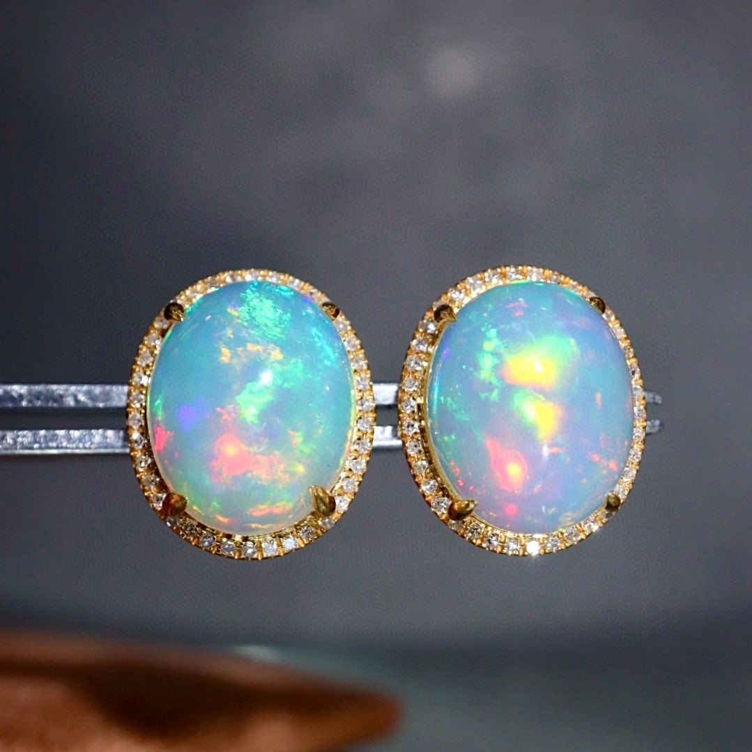 14k Gold 5.03 Ctw Natural Opal & Diamond Earrings: Ref:231177091 // gold content:14k gold // main gemstone:opal // number of stones:2 // shape:oval // carat weight:4. 8ct // color:white // treatment:natural // // adjacent gemstone 2 : diamond // shape
