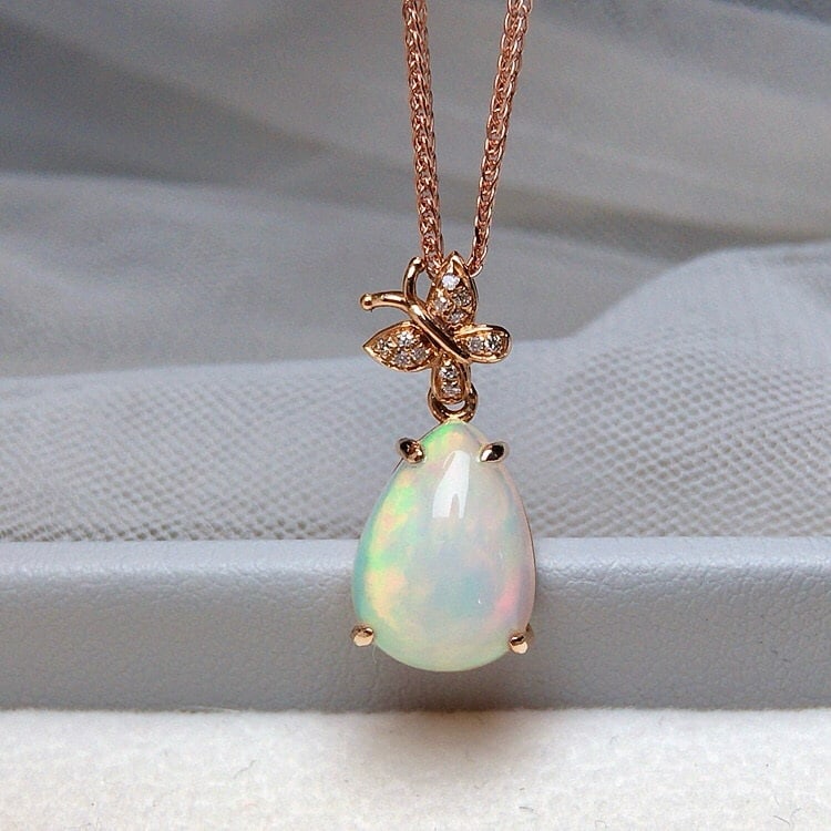 14k Gold 2.70 Ct Natural Opal & Diamond Pendant( Without Chain ): Ref:231177234 // gold content:14k gold // main gemstone:opal // shape:pear // carat weight:2. 70ct // color:white // treatment:natural // // adjacent gemstone 2 : diamond // number of stones:12 // sha