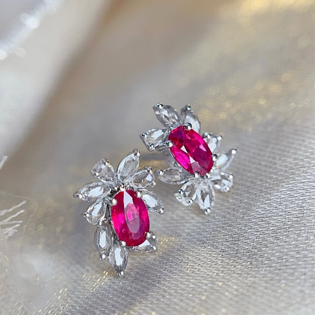 14k Gold 0.65 Ct Natural Ruby & Sapphire Earrings: Ref:231178311 // gold content:14k gold // main gemstone:ruby // shape:oval // carat weight:0. 65ct // color:red // treatment:natural // // adjacent gemstone 2 : sapphire // number of stones:18 //