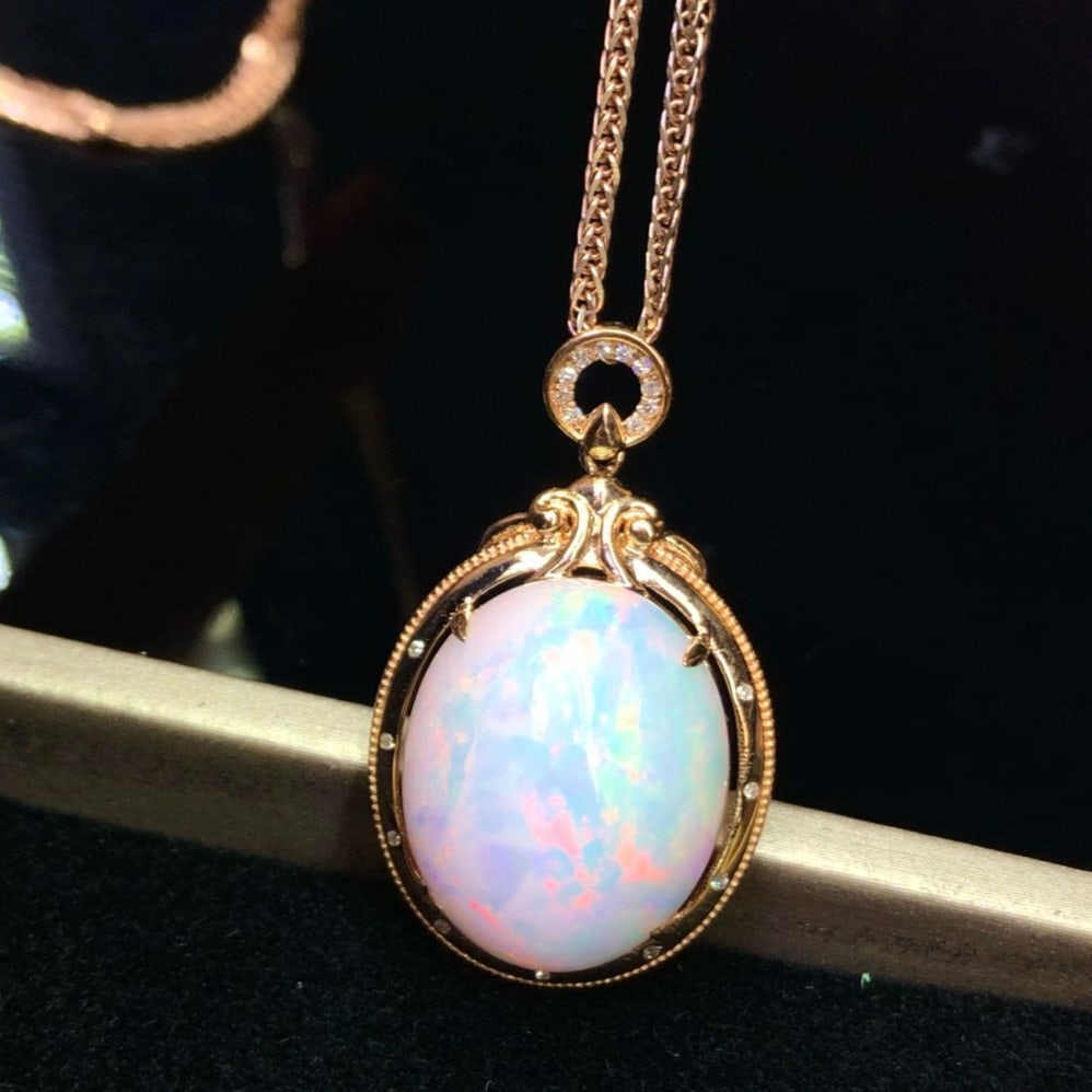 14k Gold 12.85 Ct Natural Opal & Diamond Pendant( Without Chain ): Ref:231178440 // gold content:14k gold // main gemstone:opal // shape:oval // carat weight:12. 85ct // color:color // treatment:natural // // adjacent gemstone 2 : diamond // number of stones:19 // sh