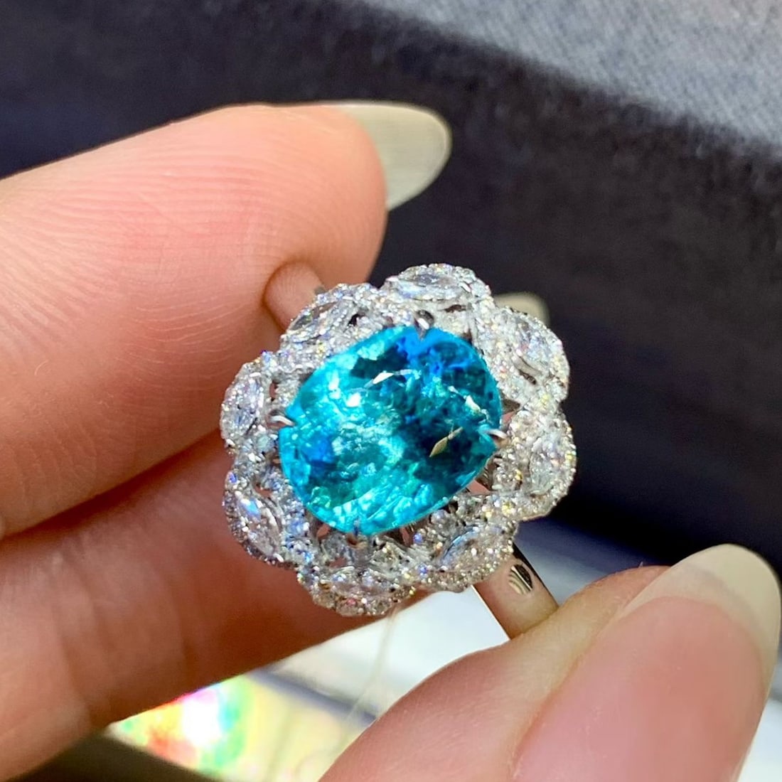 14k Gold 2.31 Ctw Natural Paraiba Tourmaline & Diamond Ring: Ref:231179065 // gold content:14k gold // ring size:7. 25us // // main gemstone:paraiba tourmaline // shape:oval // carat weight:1. 85ct // color:blue // treatment:natural // // adjacent gemstone 2 :