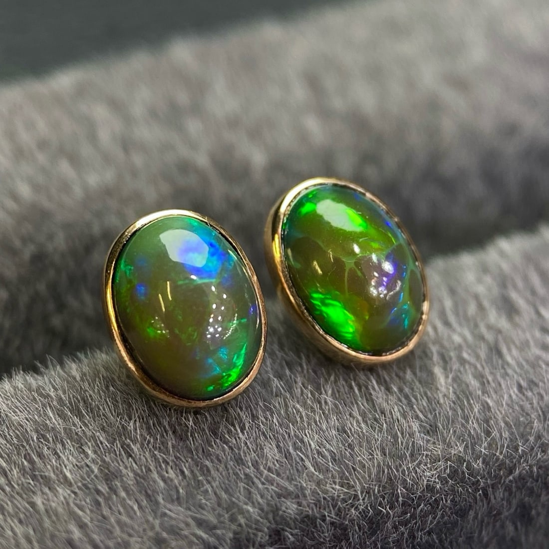 14k Gold 1.68 Ct Natural Opal Earrings: Ref:231180044 // gold content:14k gold // main gemstone:opal // shape:oval // carat weight:1. 68ct // color:color // treatment:natural // Condition: New Low Estimate: 12000.00 High Estimate: 17000.00