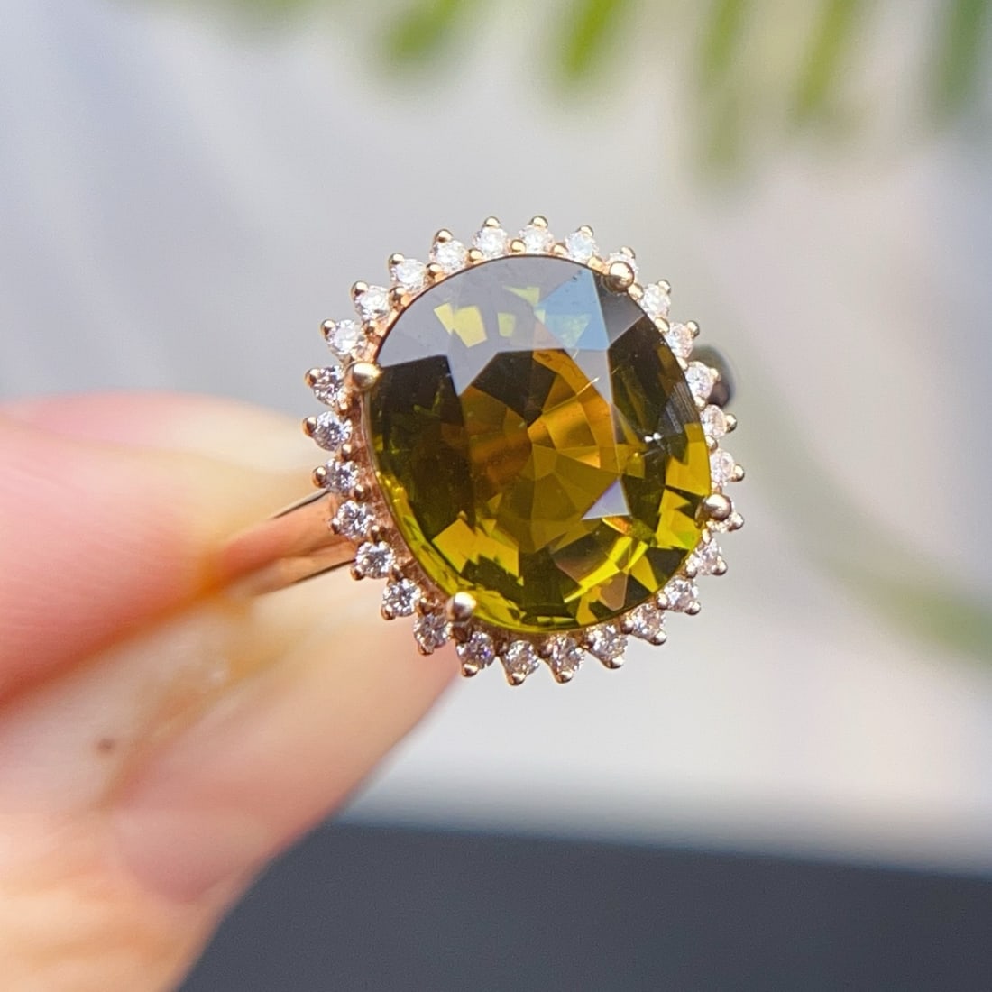 14k Gold 5.78 Ctw Natural Tourmaline & Diamond Ring: Ref:231180113 // gold content:14k gold // ring size:7. 25us // // main gemstone:tourmaline // shape:oval // carat weight:5. 5ct // color:yellowish green // treatment:natural // // adjacent gemstone 2