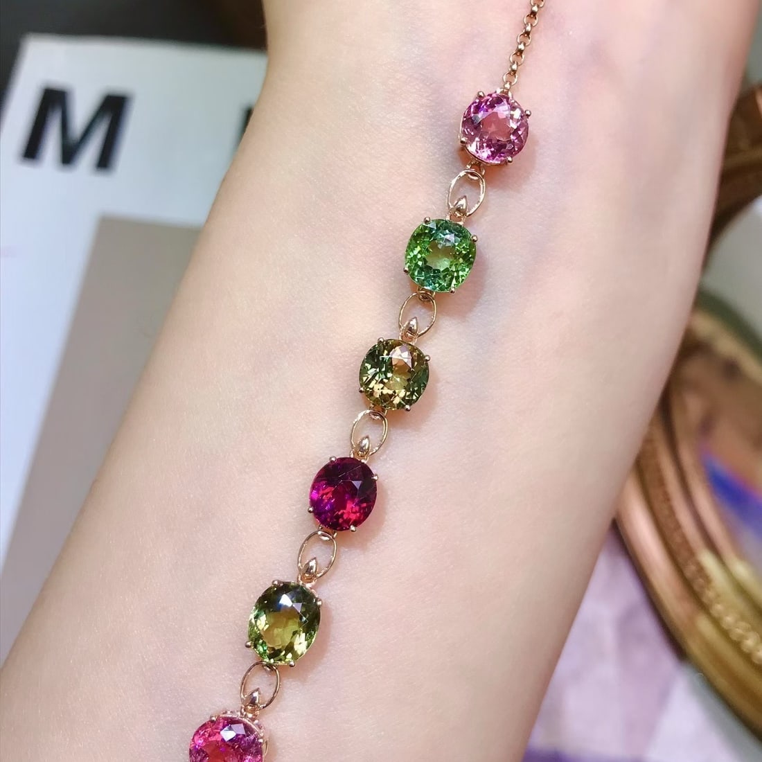 14k Gold 8.5 Ct Natural Tourmaline Bracelet: Ref:231180177 // gold content:14k gold // main gemstone:tourmaline // shape:oval // carat weight:8. 5ct // color:color // treatment:natural // Condition: New Low Estimate: 5700.00 High Estimate: