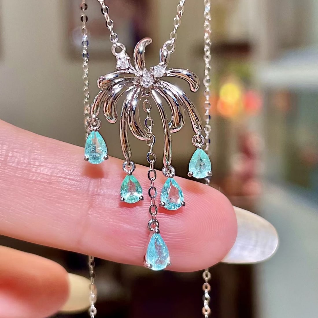 14k Gold 0.78 Ctw Natural Paraiba Tourmaline & Diamond Necklace: Ref:231180253 // gold content:14k gold // main gemstone:paraiba tourmaline // shape:pear // carat weight:0. 73ct // color:blue // treatment:natural // // adjacent gemstone 2 : diamond // shape:round