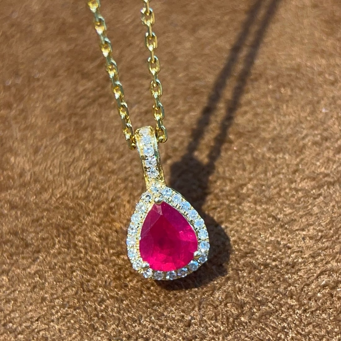 14k Gold 0.59 Ctw Natural Ruby & Diamond Pendant( Without Chain ): Ref:231180254 // gold content:14k gold // main gemstone:ruby // shape:pear // carat weight:0. 45ct // color:red // treatment:natural // // adjacent gemstone 2 : diamond // shape:round // carat
