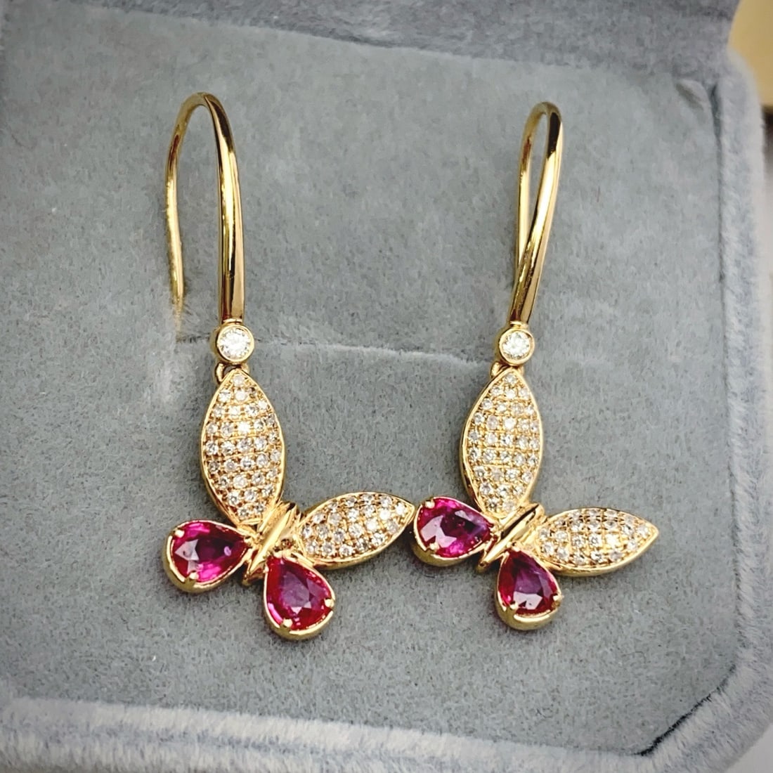 14k Gold 1.10 Ct Natural Ruby & Diamond & Butterfly Earrings: Ref:231180319 // gold content:14k gold // main gemstone:ruby // shape:pear // carat weight:1. 10ct // color:red // treatment:natural // // adjacent gemstone 2 : diamond // number of stones:108 // shap