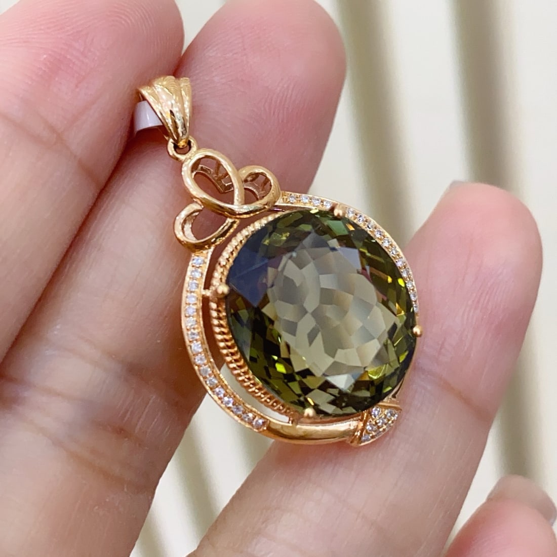 14k Gold 4.65 Ct Natural Tourmaline & Diamond Pendant( Without Chain ): Ref:231180333 // gold content:14k gold // main gemstone:tourmaline // shape:oval // carat weight:4. 65ct // color:green // treatment:natural // // adjacent gemstone 2 : diamond // number of stones:40 