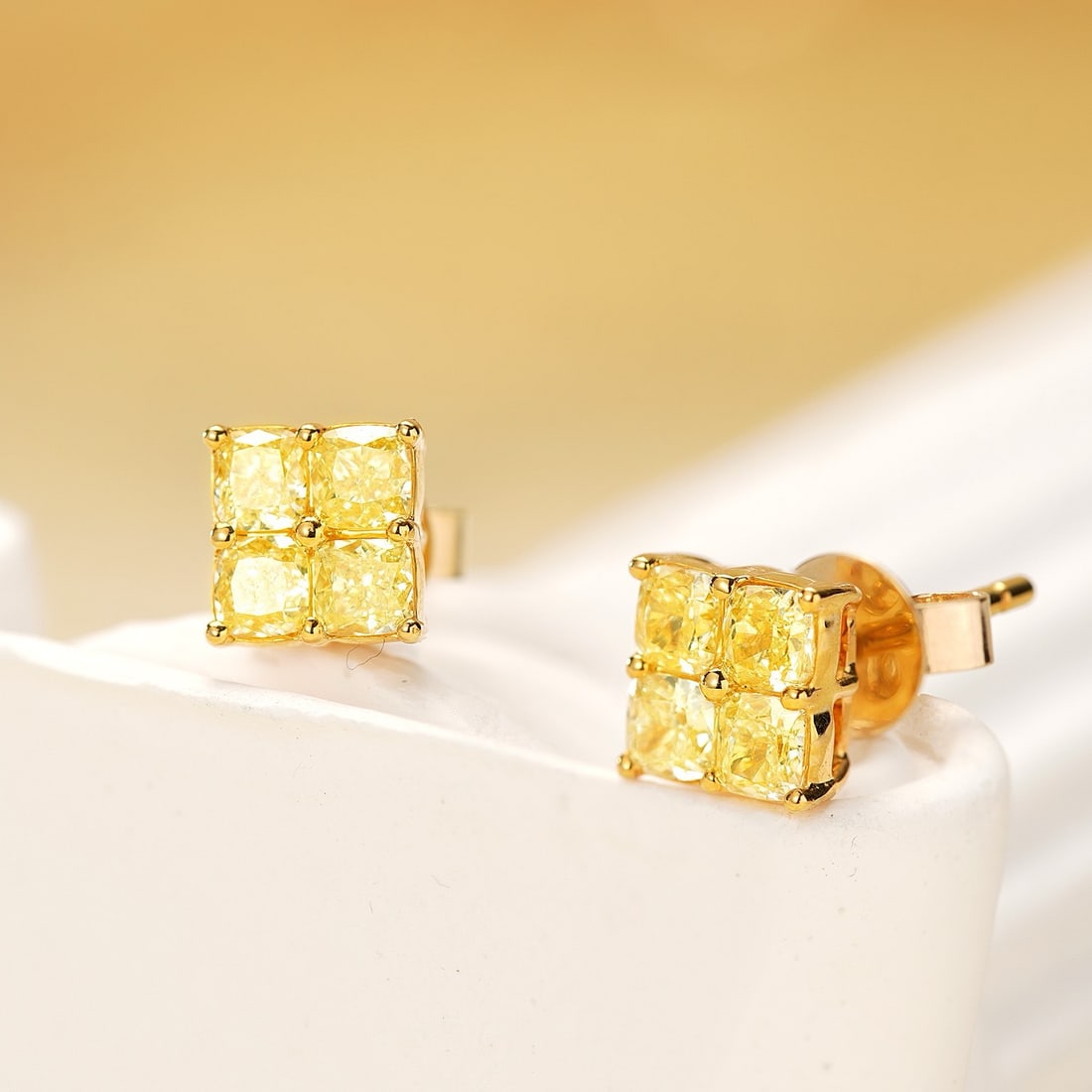 14k Gold 0.58 Ct Natural Yellow Diamond Earrings: Ref:231180392 // gold content:14k gold // main gemstone:yellow diamond // shape:cushion // carat weight:0. 58ct // color:yellow // treatment:natural // Condition: New Low Estimate: 2400.00 High