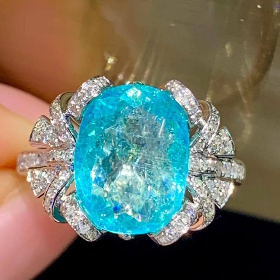 14k Gold 3.9 Ct Natural Paraiba Tourmaline & Diamond Ring: Ref:231181110 // gold content:14k gold // ring size:7. 25us // // main gemstone:paraiba tourmaline // shape:oval // carat weight:3. 9ct // color:blue // treatment:natural // // adjacent gemstone 2 :