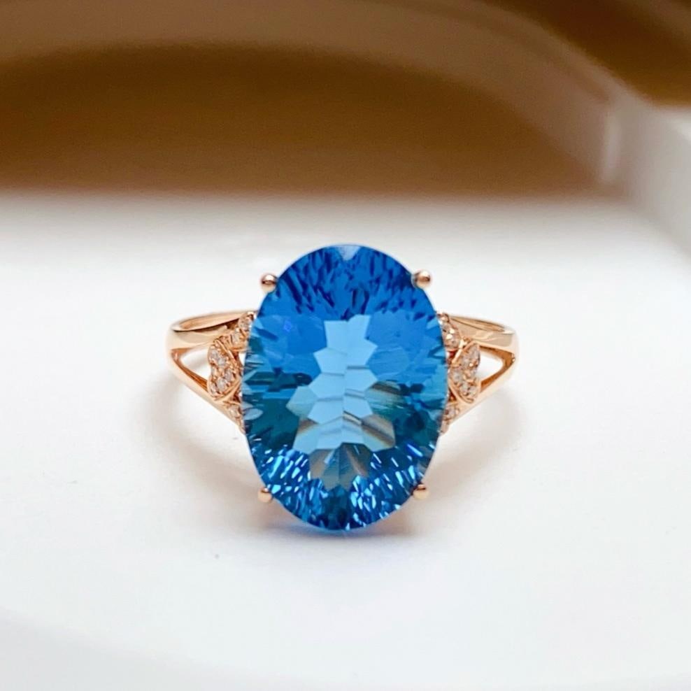 14k Gold 6.80 Ct Natural Topaz & Diamond Ring: Ref:231181157 // gold content:14k gold // ring size:7. 25us // // main gemstone:topaz // shape:oval // carat weight:6. 80ct // color:blue // treatment:natural // // adjacent gemstone 2 : diamond //