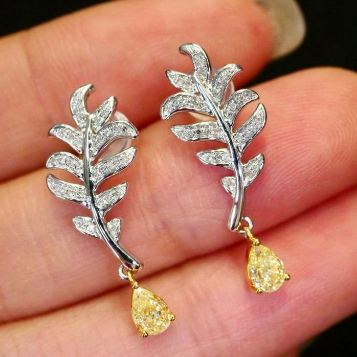 14k Gold 0.63 Ctw Natural Yellow Diamond & Diamond Earrings: Ref:231181245 // gold content:14k gold // main gemstone:yellow diamond // shape:pear // carat weight:0. 51ct // color:yellow // treatment:natural // // adjacent gemstone 2 : diamond // shape:round //