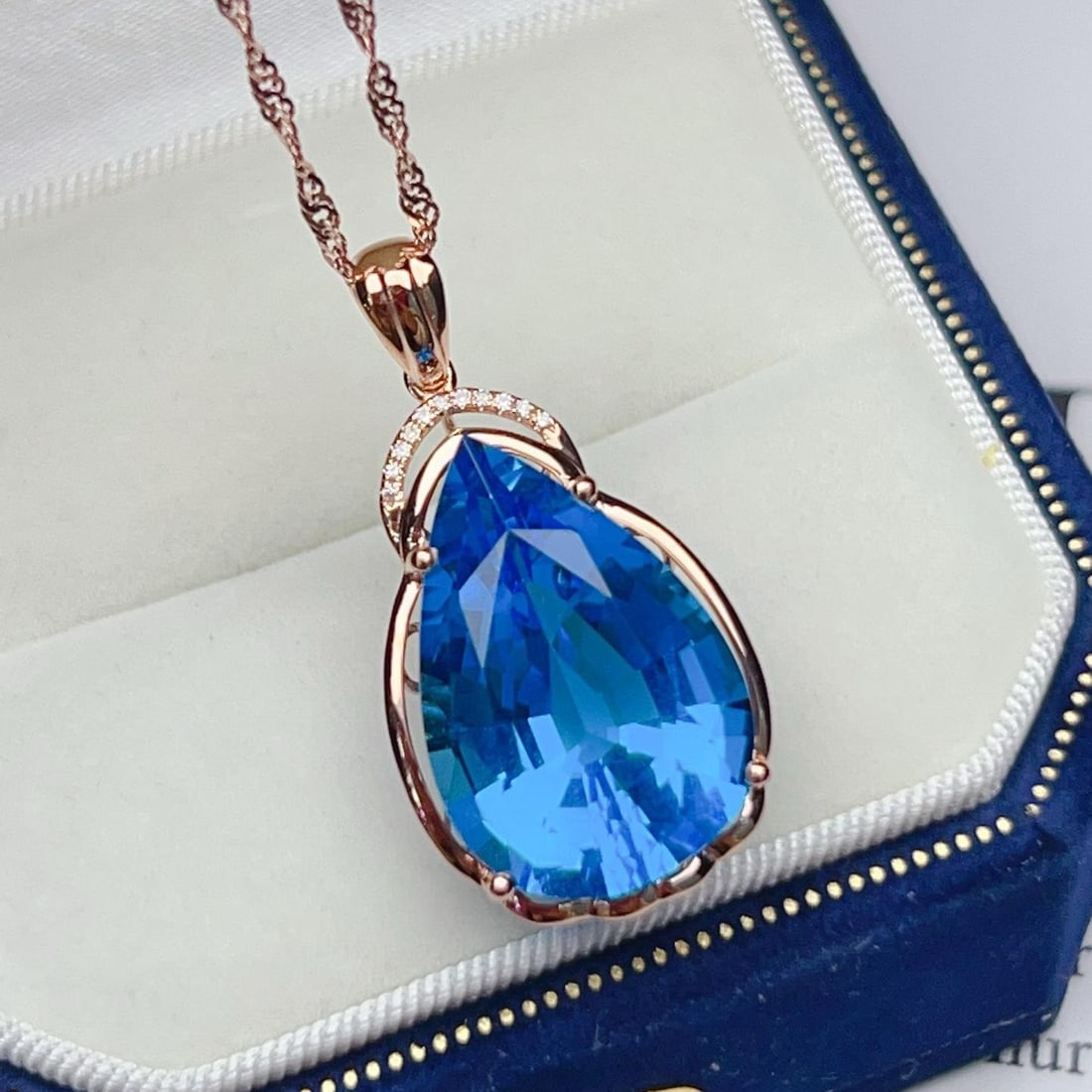 14k Gold 16.93 Ctw Natural Topaz & Diamond Pendant( Without Chain ): Ref:231181255 // gold content:14k gold // main gemstone:topaz // shape:pear // carat weight:16. 9ct // color:blue // treatment:natural // // adjacent gemstone 2 : diamond // number of stones:11 //