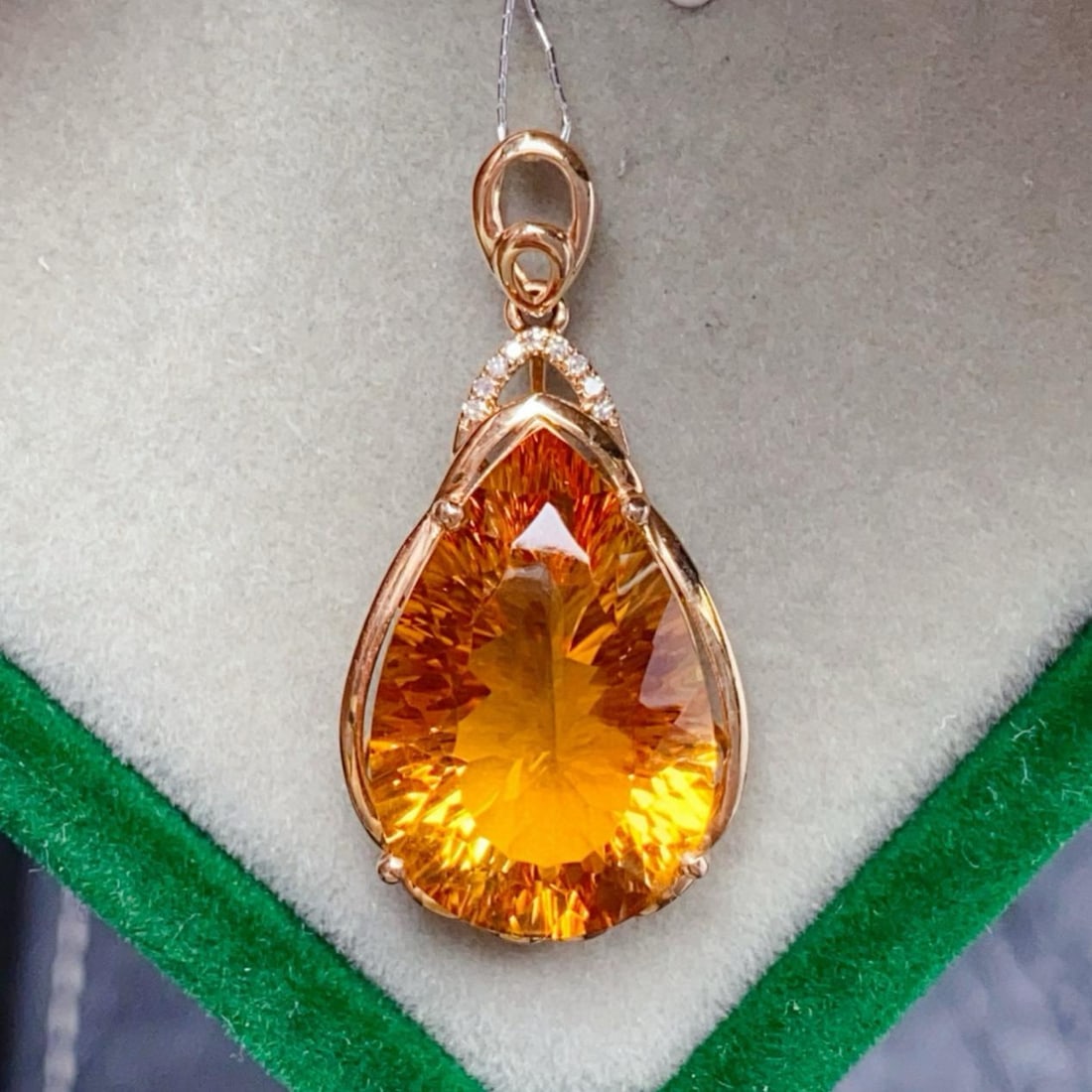 14k Gold 9.22 Ctw Natural Citrine & Diamond Pendant( Without Chain ): Ref:231182021 // gold content:14k gold // main gemstone:citrine // shape:pear // carat weight:9. 2ct // color:yellow // treatment:natural // // adjacent gemstone 2 : diamond // number of stones:9 //