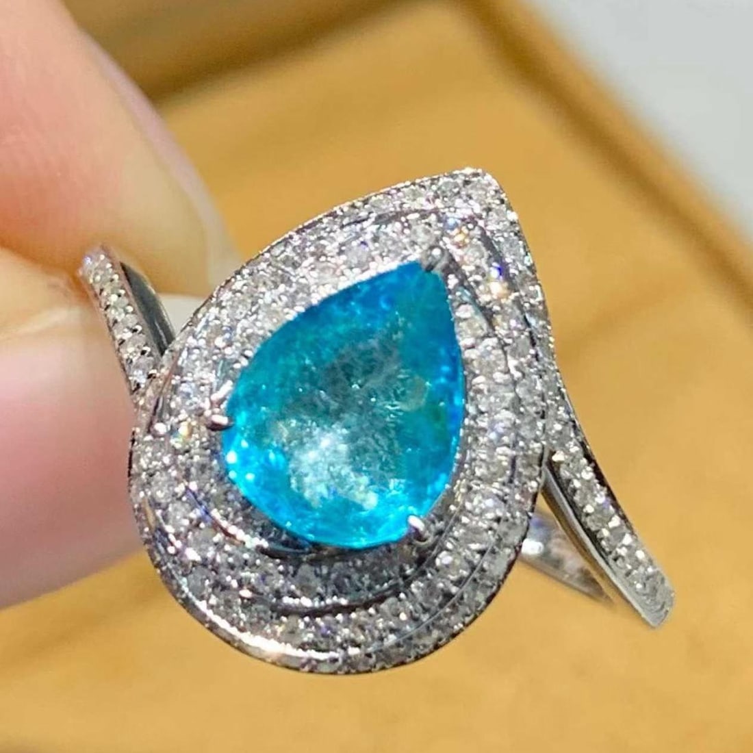 14k Gold 1.05 Ct Natural Paraiba Tourmaline & Diamond Ring: Ref:231182058 // gold content:14k gold // ring size:7. 25us // // main gemstone:paraiba tourmaline // shape:pear // carat weight:1. 05ct // color:blue // treatment:natural // // adjacent gemstone 2 :