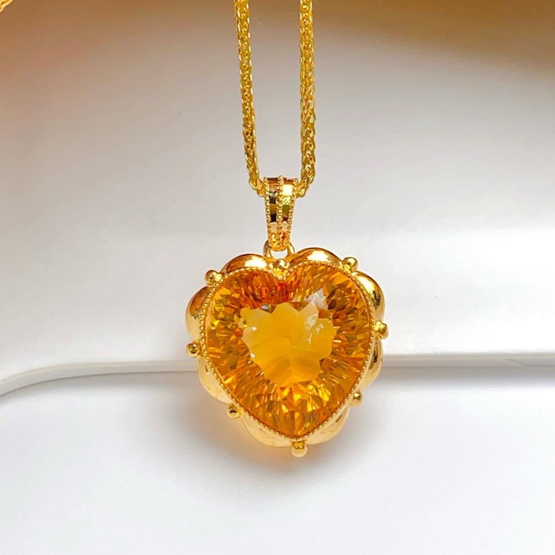 14k Gold 8.80 Ct Natural Citrine Pendant( Without Chain ): Ref:231182110 // gold content:14k gold // main gemstone:citrine // shape:heart // carat weight:8. 80ct // color:yellow // treatment:natural // Condition: New Low Estimate: 1900.00 High Estimate: