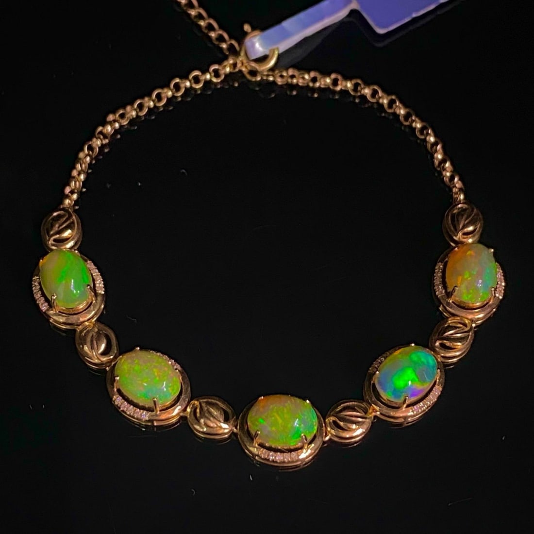 14k Gold 4.05 Ct Natural Opal & Diamond Bracelet: Ref:231182219 // gold content:14k gold // main gemstone:opal // shape:oval // carat weight:4. 05ct // color:color // treatment:natural // // adjacent gemstone 2 : diamond // number of stones:50 // sha
