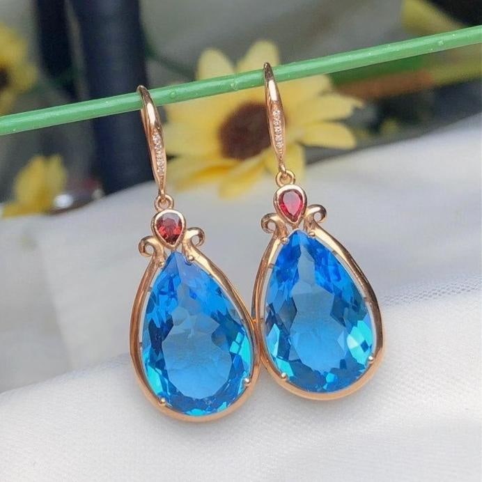 14k Gold 22.6 Ct Natural Topaz & Diamond Earrings: Ref:231182244 // gold content:14k gold // main gemstone:topaz // shape:pear // carat weight:22. 6ct // color:blue // treatment:natural // // adjacent gemstone 2 : diamond // number of stones:10 //