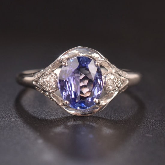 14k Gold 1.4 Ct Natural Tanzanite & Diamond Ring: Ref:231182333 // gold content:14k gold // ring size:7. 25us // // main gemstone:tanzanite // shape:oval // carat weight:1. 4ct // color:blue // treatment:natural // // adjacent gemstone 2 : diamond