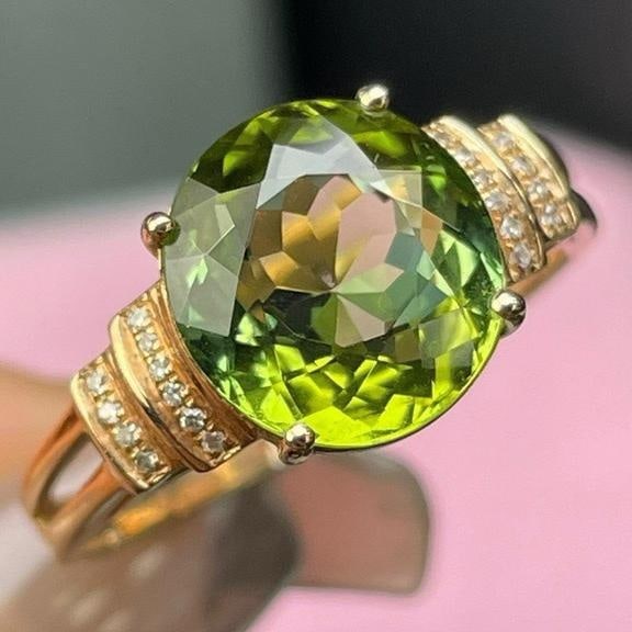 14k Gold 3 Ct Natural Tourmaline & Diamond Ring: Ref:231182337 // gold content:14k gold // ring size:7. 25us // // main gemstone:tourmaline // shape:oval // carat weight:3ct // color:green // treatment:natural // // adjacent gemstone 2 : diamond //