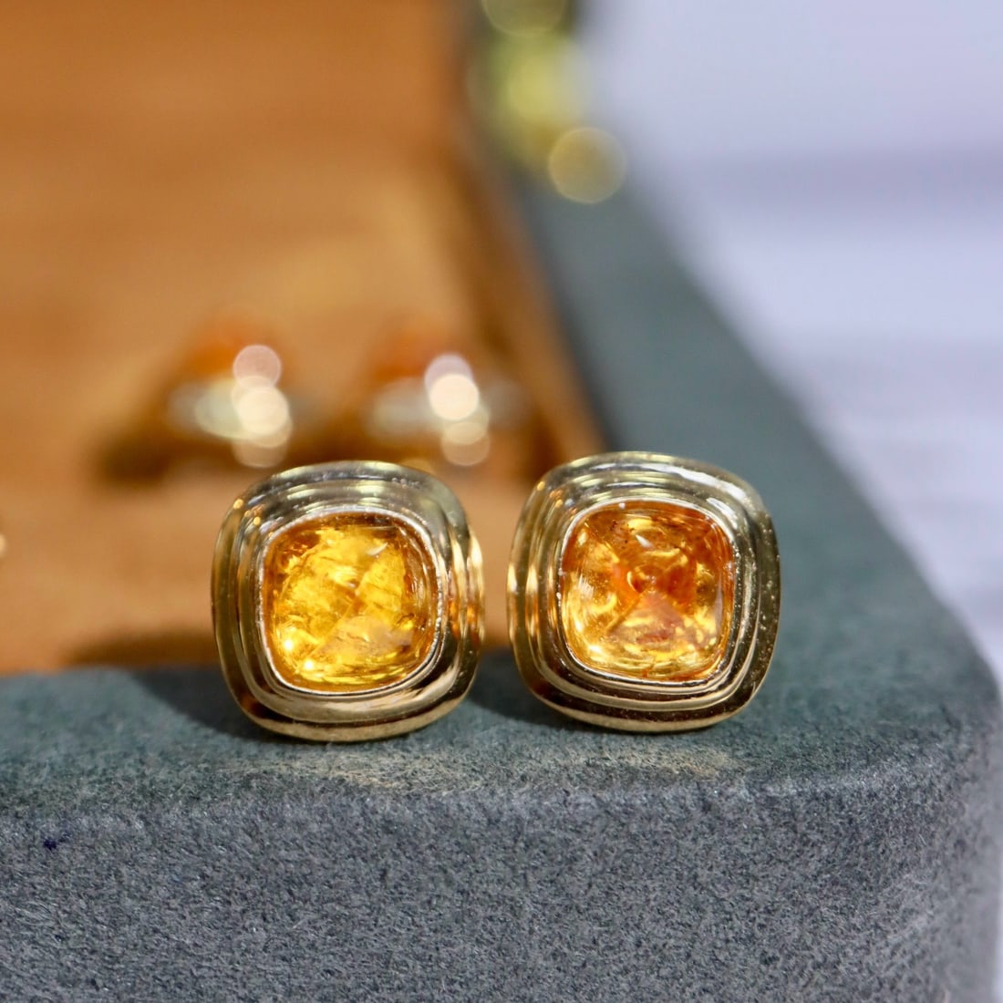 14k Gold 2.5 Ct Natural Spessartine Earrings: Ref:231182386 // gold content:14k gold // main gemstone:spessartine // shape:sugar-loaf // carat weight:2. 5ct // color:orange // treatment:natural // Condition: New Low Estimate: 2400.00 High