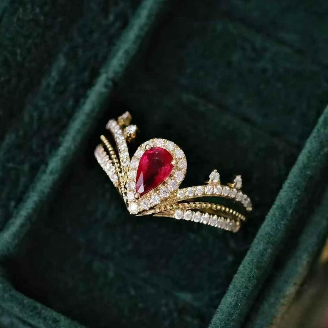 14k Gold 0.92 Ctw Natural Ruby & Diamond Ring: Ref:231182400 // gold content:14k gold // ring size:7. 25us // // main gemstone:ruby // shape:pear // carat weight:0. 56ct // color:pigeonblood red // treatment:natural // // adjacent gemstone 2 :