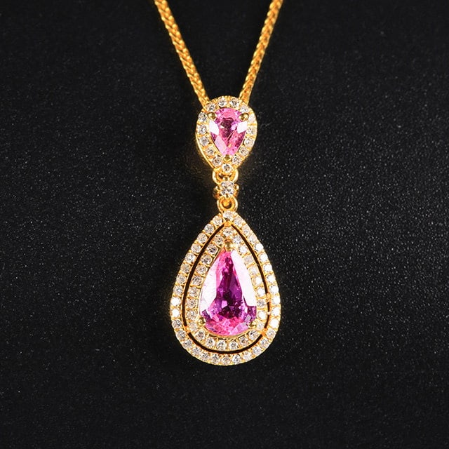 14k Gold 1.25 Ctw Natural Padparadscha Sapphire & Diamond Pendant( Without Chain ): Ref:231182404 // gold content:14k gold // main gemstone:padparadscha sapphire // shape:pear // carat weight:1. 02ct // color:orangish pink // treatment:natural // // adjacent gemstone 2 : diamond //