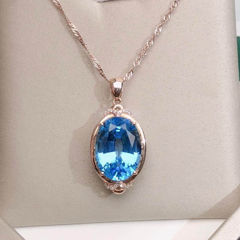 14k Gold 9.75 Ctw Natural Topaz & Diamond Pendant( Without Chain ): Ref:231183091 // gold content:14k gold // main gemstone:topaz // shape:oval // carat weight:9. 7ct // color:blue // treatment:natural // // adjacent gemstone 2 : diamond // number of stones:18 //
