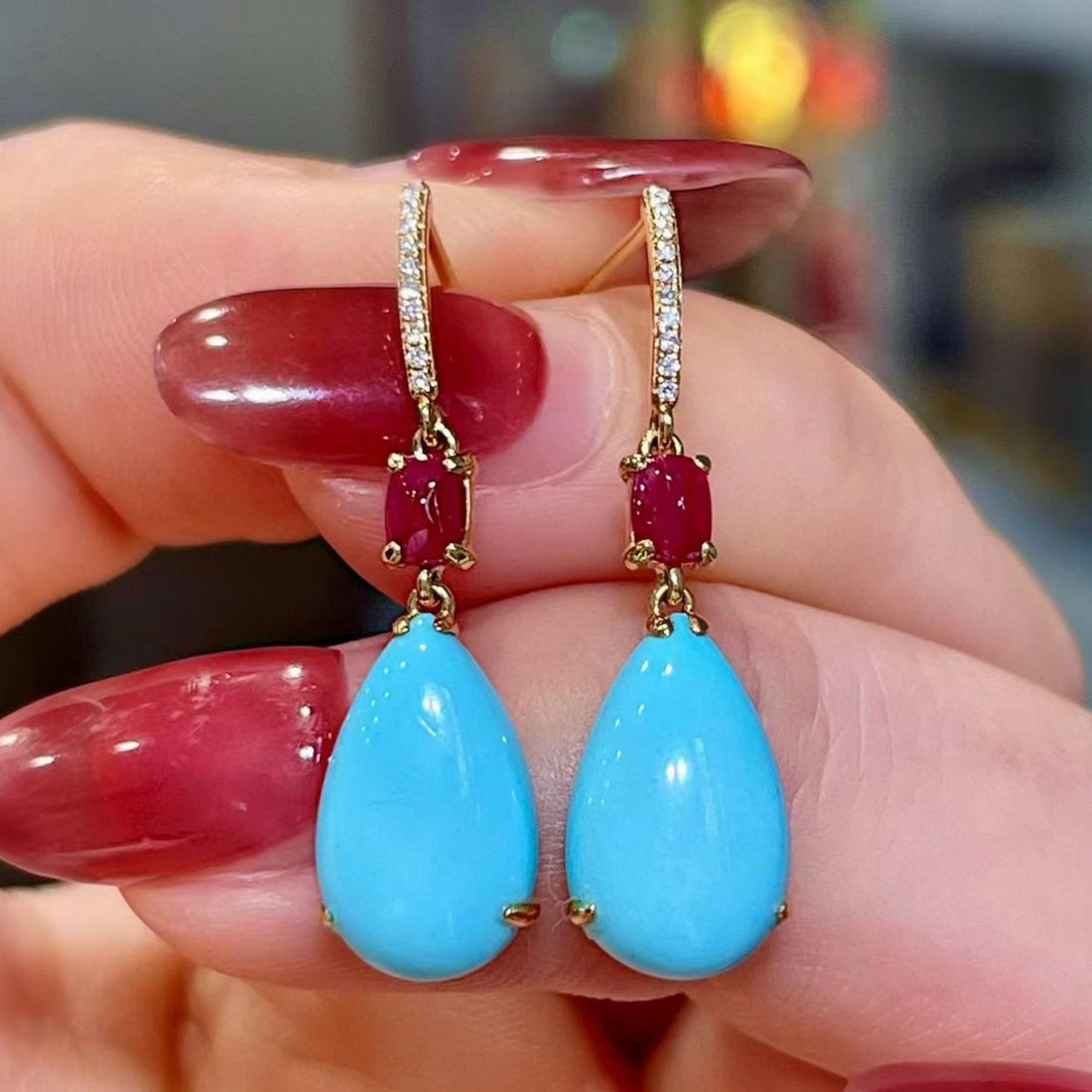 14k Gold 5.41 Ctw Natural Blue Turquoise & Ruby Earrings: Ref:231183144 // gold content:14k gold // main gemstone:blue turquoise // shape:pear // carat weight:4. 98ct // color:blue // treatment:natural // // adjacent gemstone 2 : ruby // shape:sugar-loaf //