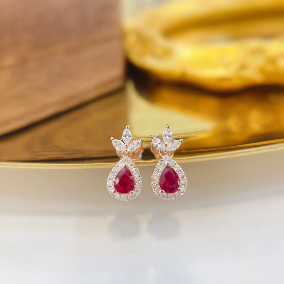 14k Gold 0.82 Ctw Natural Ruby & Diamond Earrings: Ref:231183221 // gold content:14k gold // main gemstone:ruby // shape:pear // carat weight:0. 50ct // color:red // treatment:natural // // adjacent gemstone 2 : diamond // shape:multiple // carat