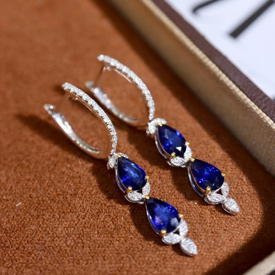 14k Gold 2.27 Ctw Natural Sapphire & Diamond Earrings: Ref:231184134 // gold content:14k gold // main gemstone:sapphire // shape:pear // carat weight:2. 11ct // color:blue // treatment:natural // // adjacent gemstone 2 : diamond // shape:round // carat