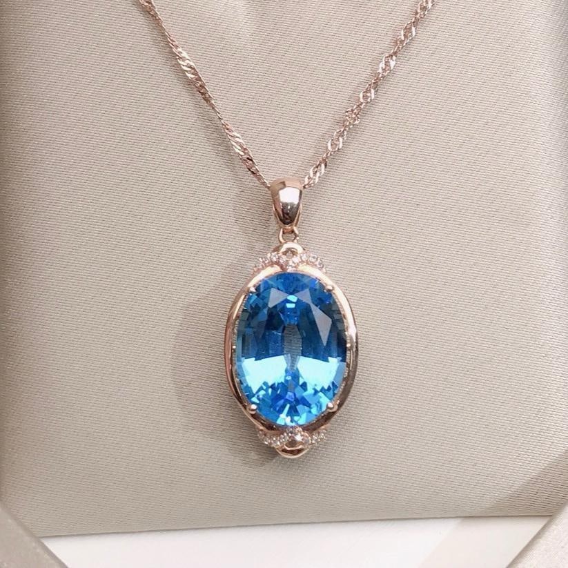 14k Gold 9.75 Ctw Natural Topaz & Diamond Pendant( Without Chain ): Ref:231184208 // gold content:14k gold // main gemstone:topaz // shape:oval // carat weight:9. 7ct // color:blue // treatment:natural // // adjacent gemstone 2 : diamond // number of stones:18 //