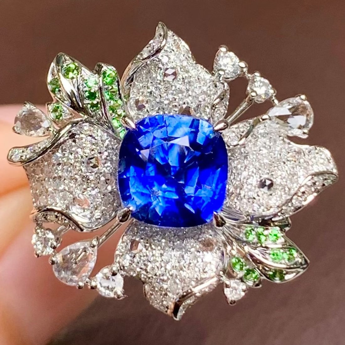 14k Gold 2.3 Ct Natural Sapphire & Diamond & Tsavorite Ring: Ref:231184401 // gold content:14k gold // ring size:7. 25us // // main gemstone:sapphire // shape:cushion // carat weight:2. 3ct // color:blue // treatment:natural // // adjacent gemstone 2 : diamond