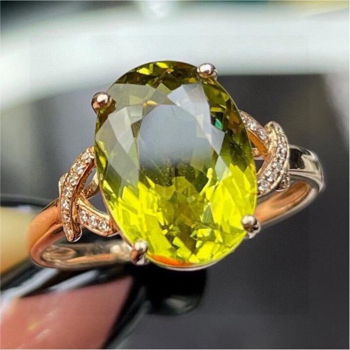 14k Gold 5.65 Ct Natural Tourmaline & Diamond Ring: Ref:231184439 // gold content:14k gold // ring size:7. 25us // // main gemstone:tourmaline // shape:oval // carat weight:5. 65ct // color:yellowish green // treatment:natural // // adjacent gemstone