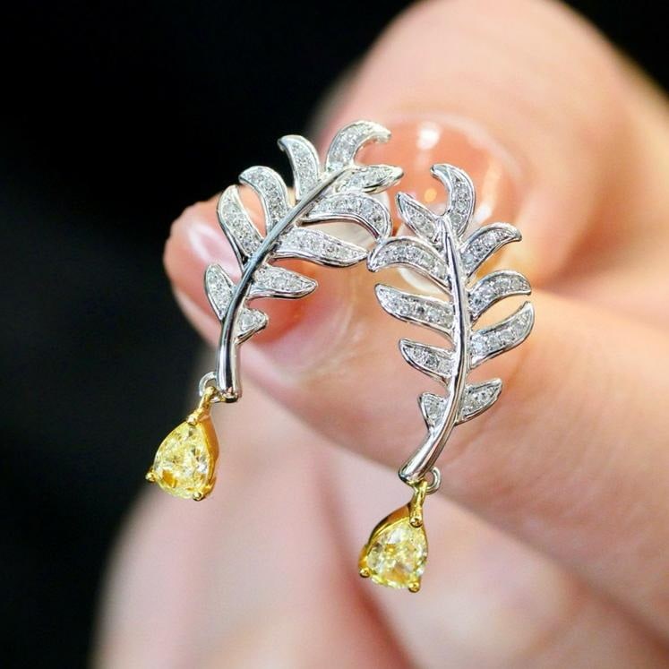 14k Gold 0.63 Ctw Natural Yellow Diamond & Diamond Earrings: Ref:231185086 // gold content:14k gold // main gemstone:yellow diamond // number of stones:2 // shape:pear // carat weight:0. 51ct // color:yellow // treatment:natural // // adjacent gemstone 2 :