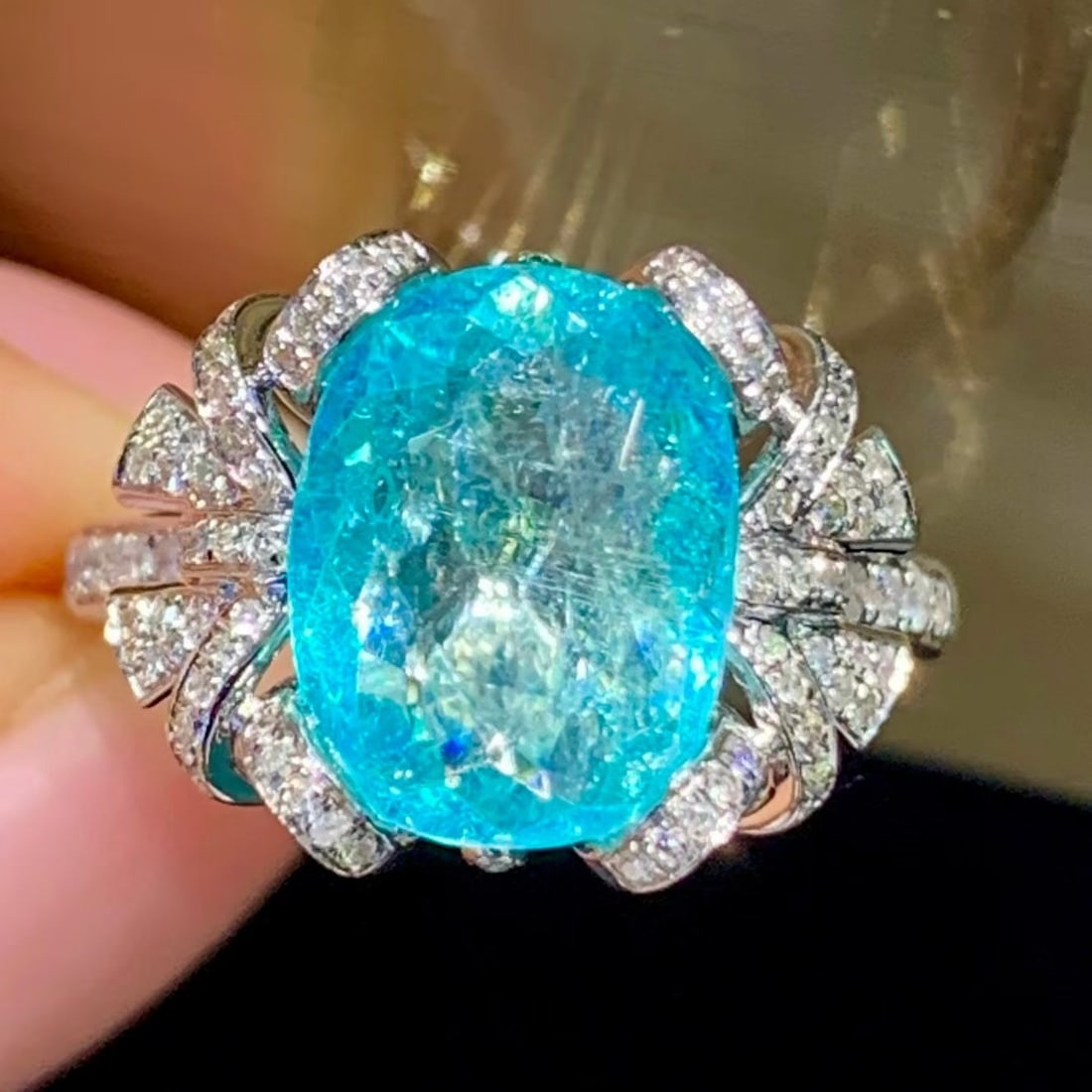 14k Gold 3.9 Ct Natural Paraiba Tourmaline & Diamond Ring: Ref:231185112 // gold content:14k gold // ring size:7. 25us // // main gemstone:paraiba tourmaline // shape:oval // carat weight:3. 9ct // color:blue // treatment:natural // // adjacent gemstone 2 :