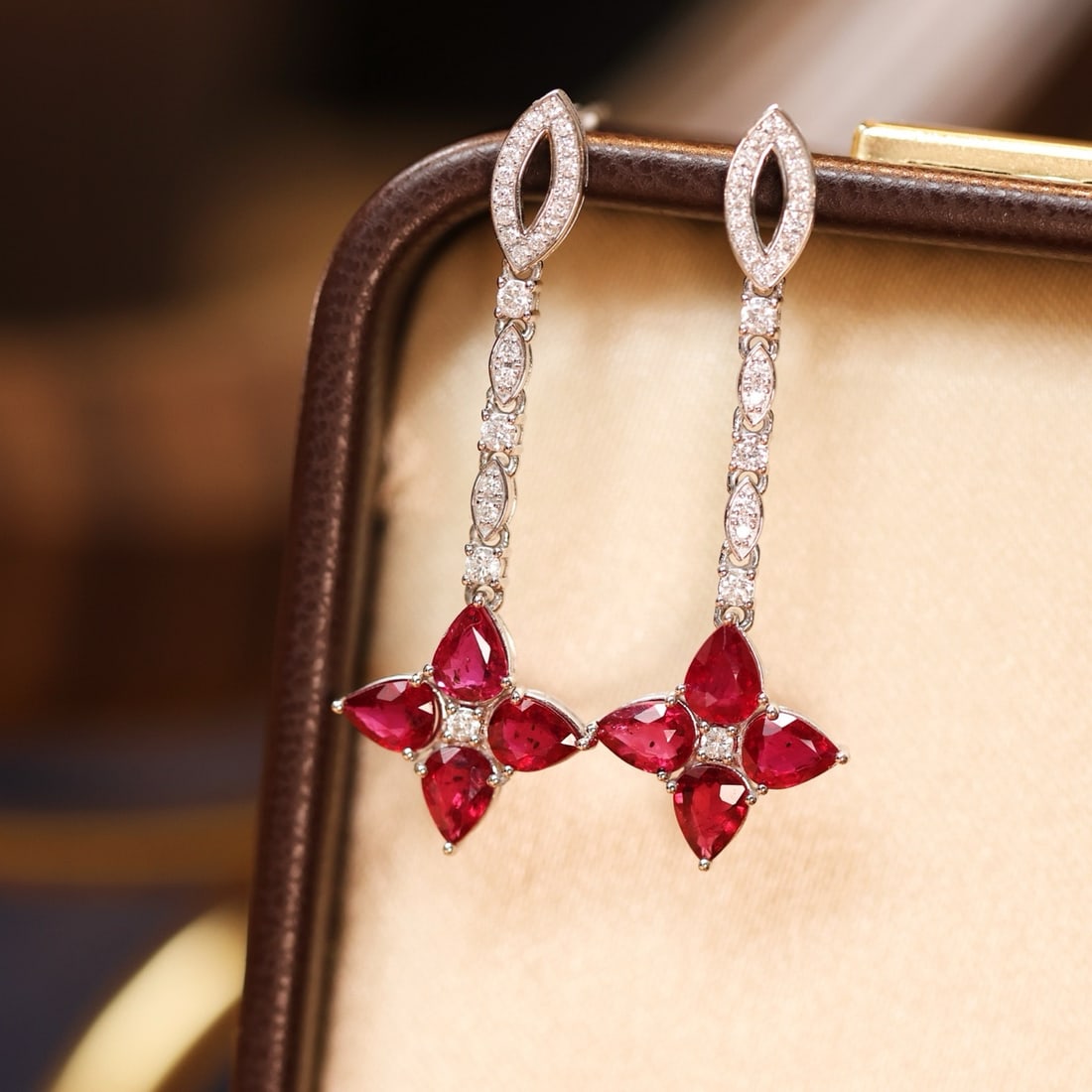 14k Gold 2.45 Ctw Natural Ruby & Diamond Earrings: Ref:231185201 // gold content:14k gold // main gemstone:ruby // shape:pear // carat weight:2. 15ct // color:red // treatment:natural // // adjacent gemstone 2 : diamond // shape:round // carat