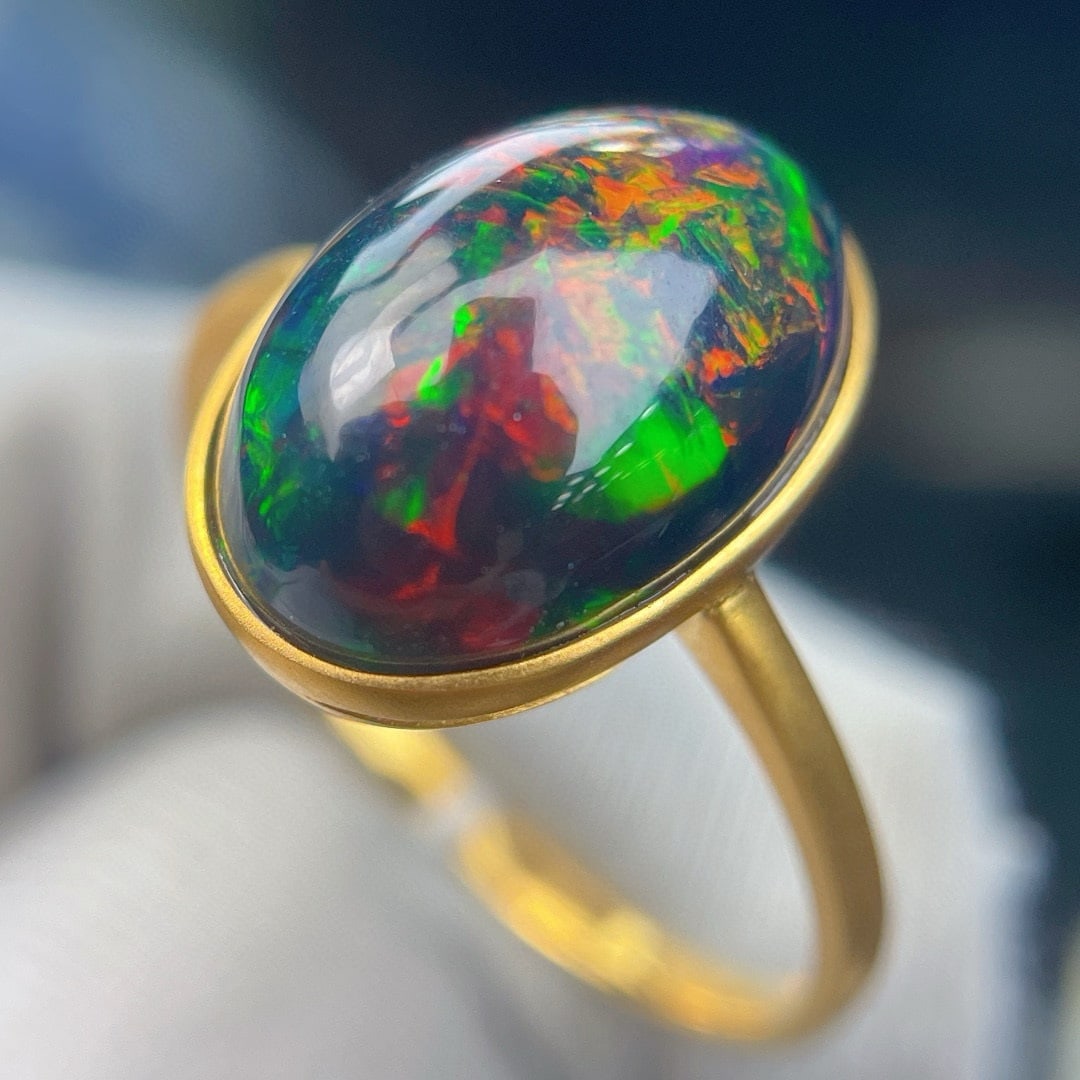 14k Gold 3.88 Ct Natural Opal Ring: Ref:231185210 // gold content:14k gold // ring size:7. 25us // // main gemstone:opal // shape:oval // carat weight:3. 88ct // color:color // treatment:natural // Condition: New Low Estimate: 1300.00