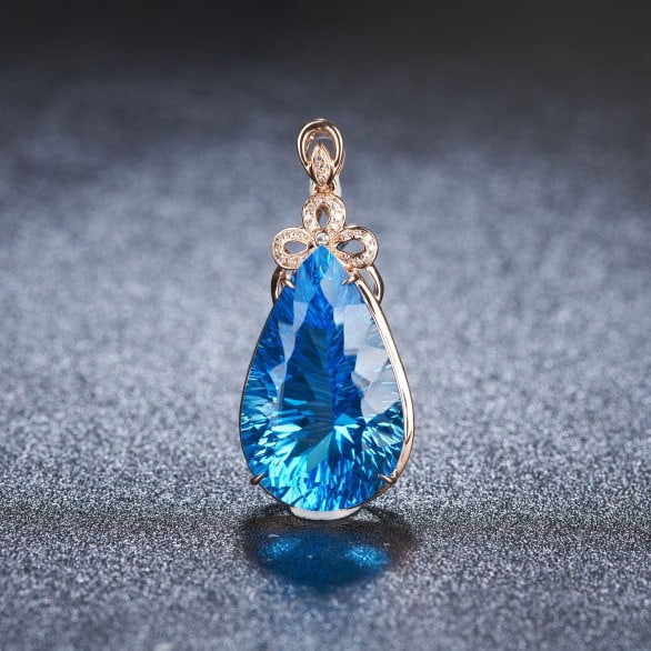 14k Gold 24 Ct Natural Topaz & Diamond Pendant( Without Chain ): Ref:231185241 // gold content:14k gold // main gemstone:topaz // shape:pear // carat weight:24ct // color:blue // treatment:natural // // adjacent gemstone 2 : diamond // shape:round // clarity