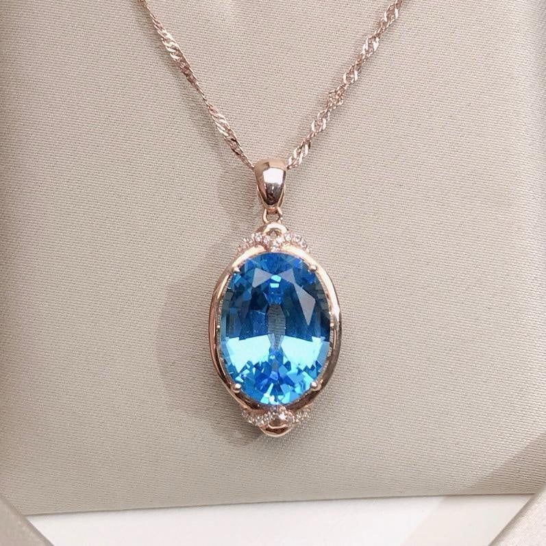 14k Gold 9.75 Ctw Natural Topaz & Diamond Pendant( Without Chain ): Ref:231185244 // gold content:14k gold // main gemstone:topaz // shape:oval // carat weight:9. 7ct // color:blue // treatment:natural // // adjacent gemstone 2 : diamond // number of stones:18 //