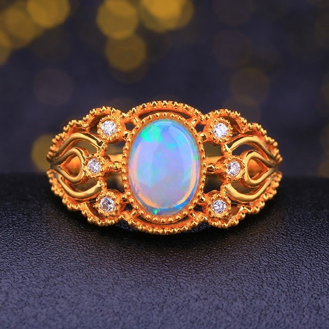 14k Gold 0.90 Ctw Natural Opal & Diamond Ring: Ref:231185259 // gold content:14k gold // ring size:7. 25us // // main gemstone:opal // shape:oval // carat weight:0. 84ct // color:white // treatment:natural // // adjacent gemstone 2 : diamond // nu