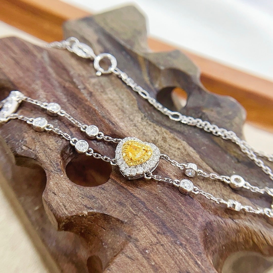 14k Gold 0.62 Ctw Natural Yellow Diamond & Diamond Bracelet: Ref:231186010 // gold content:14k gold // main gemstone:yellow diamond // shape:heart // carat weight:0. 15ct // color:yellow // treatment:natural // // adjacent gemstone 2 : diamond // shape:round