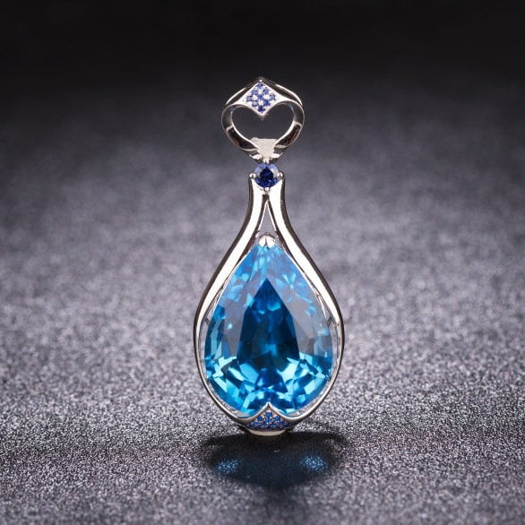 14k Gold 24.41 Ctw Natural Topaz & Sapphire Pendant( Without Chain ): Ref:231186013 // gold content:14k gold // main gemstone:topaz // shape:pear // carat weight:24. 26ct // color:blue // treatment:natural // // adjacent gemstone 2 : sapphire // shape:round // carat