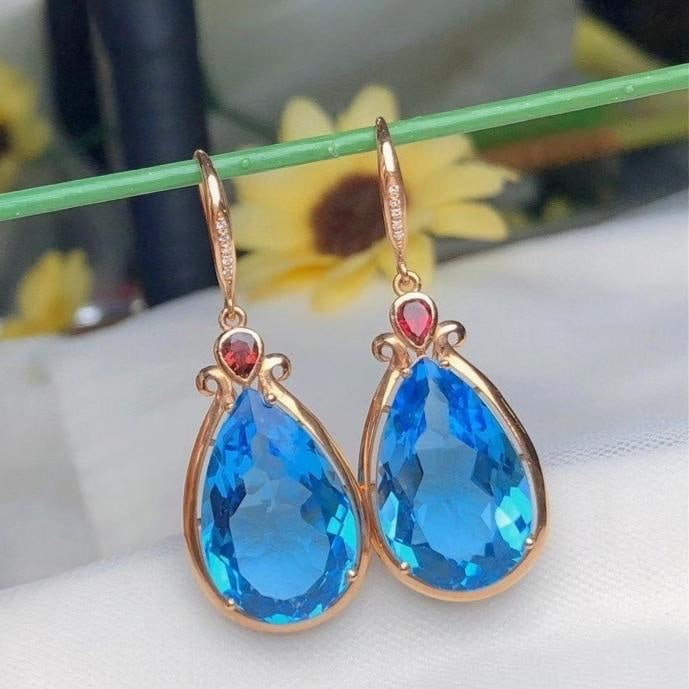 14k Gold 22.6 Ct Natural Topaz & Diamond Earrings: Ref:231186014 // gold content:14k gold // main gemstone:topaz // shape:pear // carat weight:22. 6ct // color:blue // treatment:natural // // adjacent gemstone 2 : diamond // number of stones:10 //