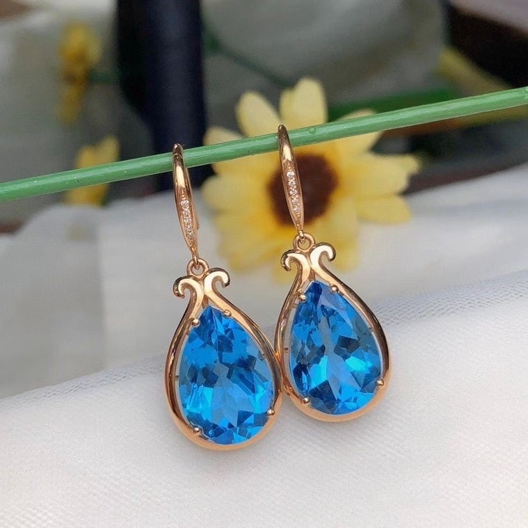 14k Gold 13.88 Ct Natural Topaz & Diamond Earrings: Ref:231186099 // gold content:14k gold // main gemstone:topaz // shape:pear // carat weight:13. 88ct // color:blue // treatment:natural // // adjacent gemstone 2 : diamond // number of stones:10 //