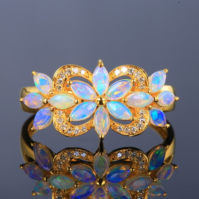 14k Gold 0.56 Ctw Natural Opal & Diamond Ring: Ref:231186132 // gold content:14k gold // ring size:7. 25us // // main gemstone:opal // shape:marquise // carat weight:0. 49ct // color:white // treatment:natural // // adjacent gemstone 2 : diamond