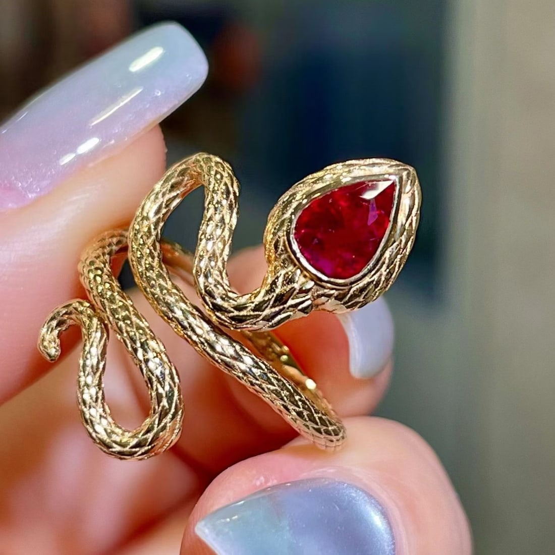 14k Gold 0.7 Ct Natural Ruby & Snake Ring: Ref:231186173 // gold content:14k gold // ring size:7. 25us // // main gemstone:ruby // shape:pear // carat weight:0. 7ct // color:red // treatment:natural // Condition: New Low Estimate: 4200.00